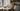 Woman organizing supplements on kitchen table